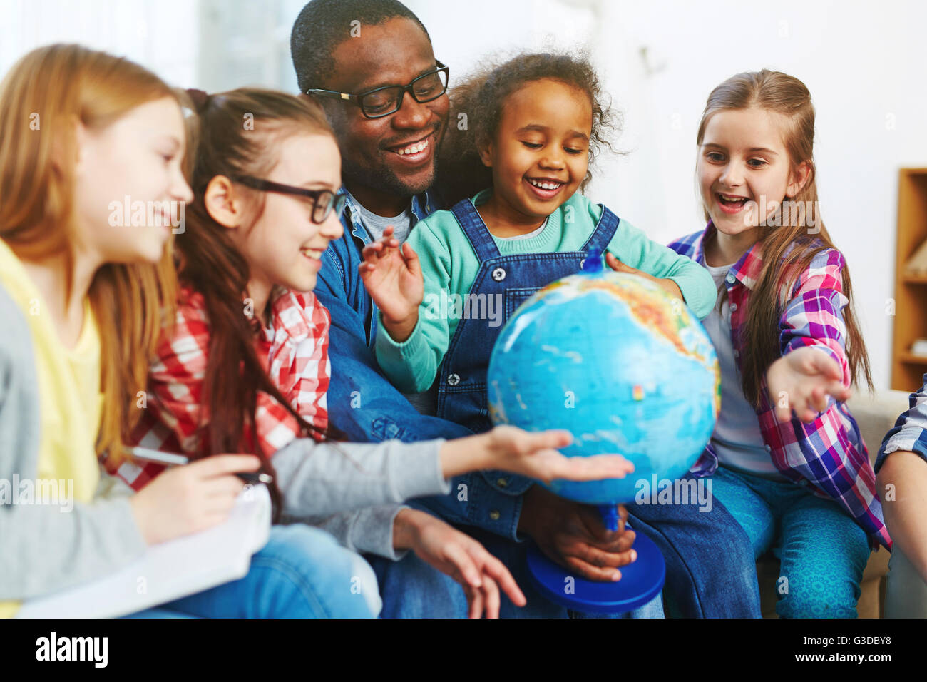 Studying the world Stock Photo - Alamy