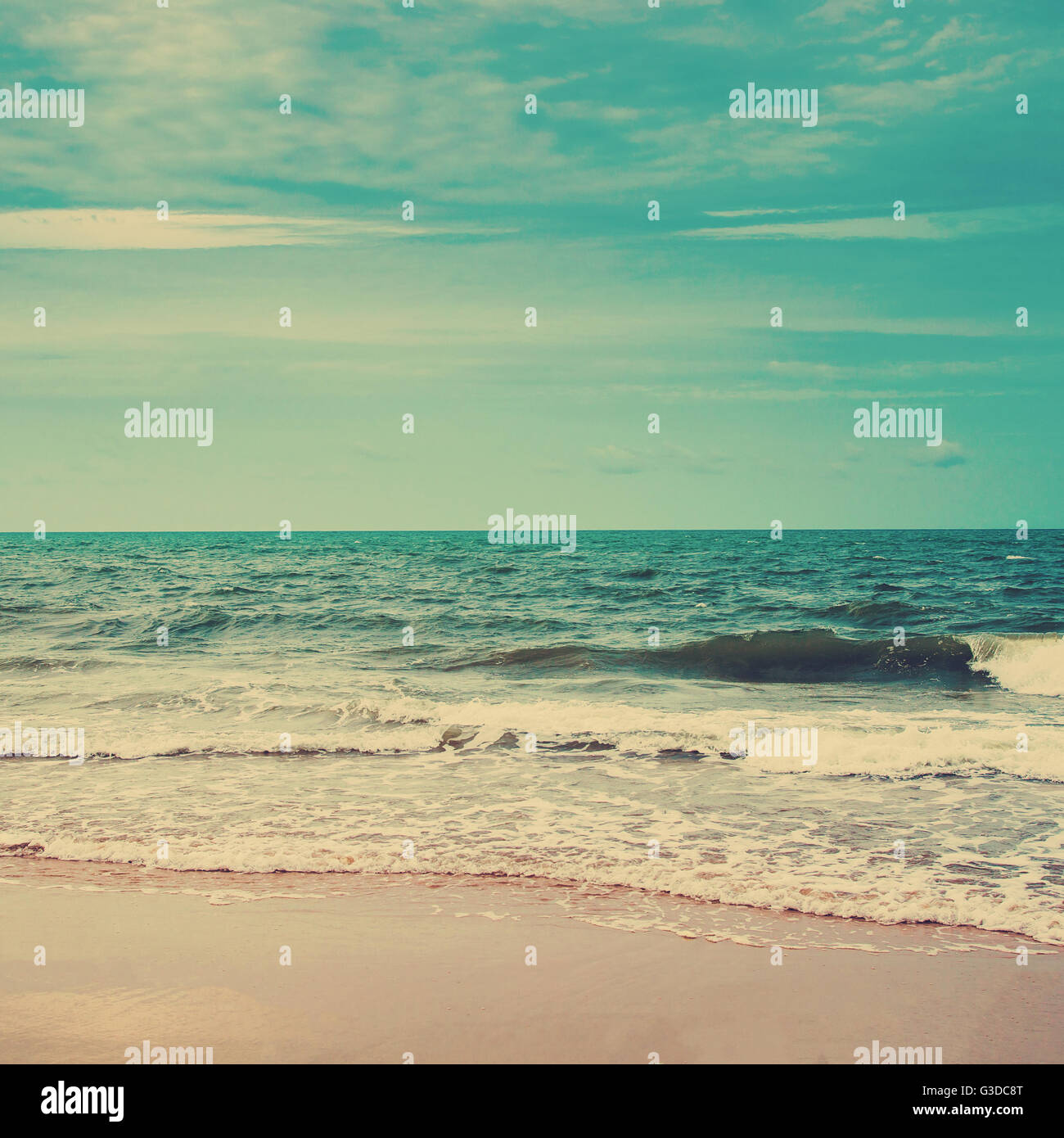 Retro beach and blue sky with vintage tone Stock Photo - Alamy