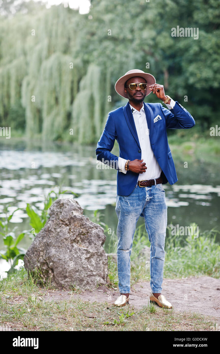 Full length portrait of stylish black man at jacket, hat and sunglasses ...