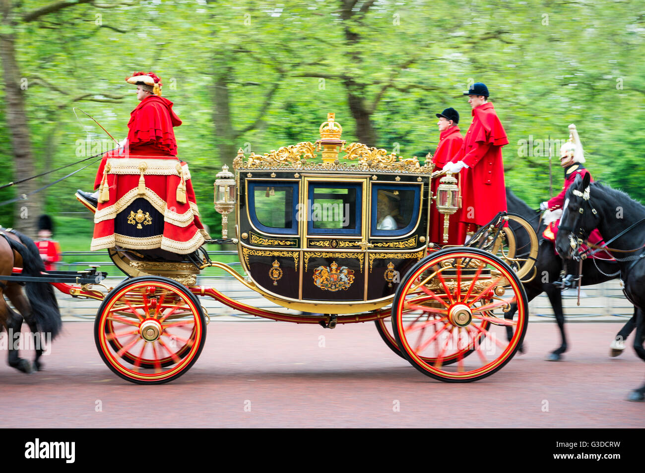 LONDON - MAY 18, 2016: A horse-drawn carriage, the Irish State Coach carries Charles, Prince of Wales and Camilla on the Mall. Stock Photo
