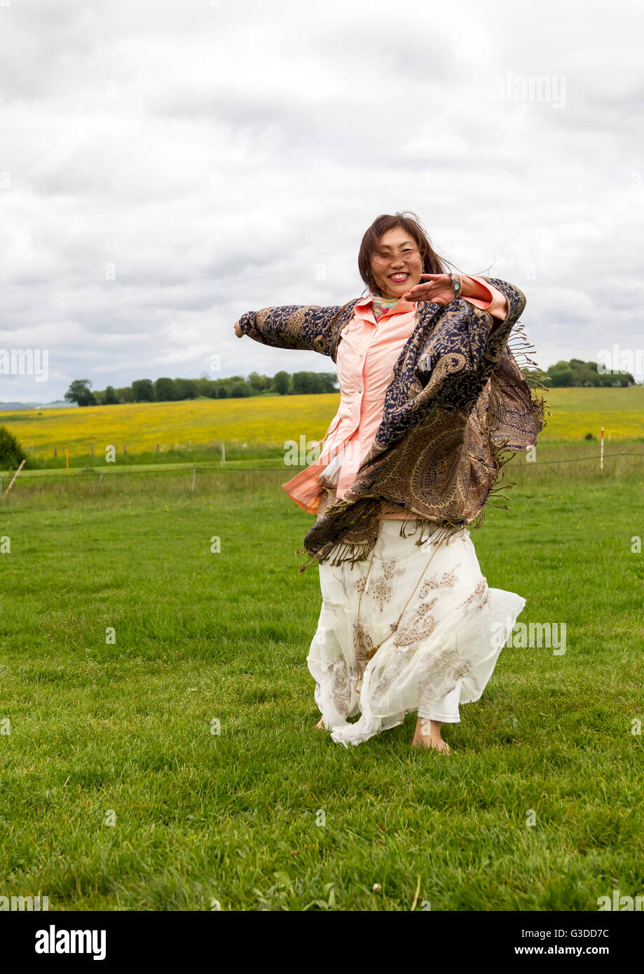 Japanese Dance instructor dancing at Stonehenge  Wiltshire Stock Photo