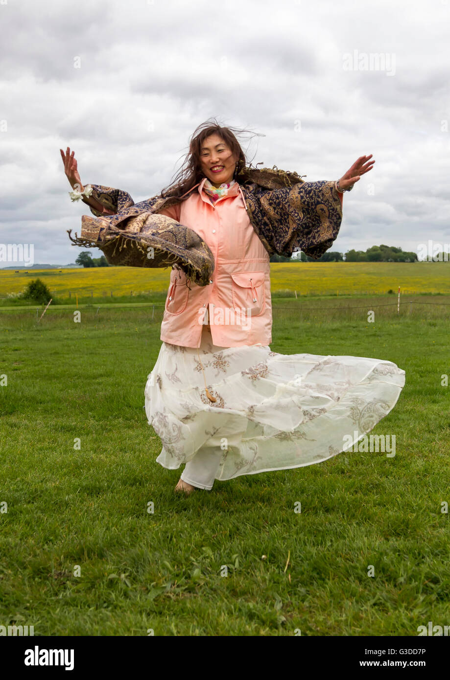 Japanese Dance instructor dancing at Stonehenge Wiltshire Stock Photo