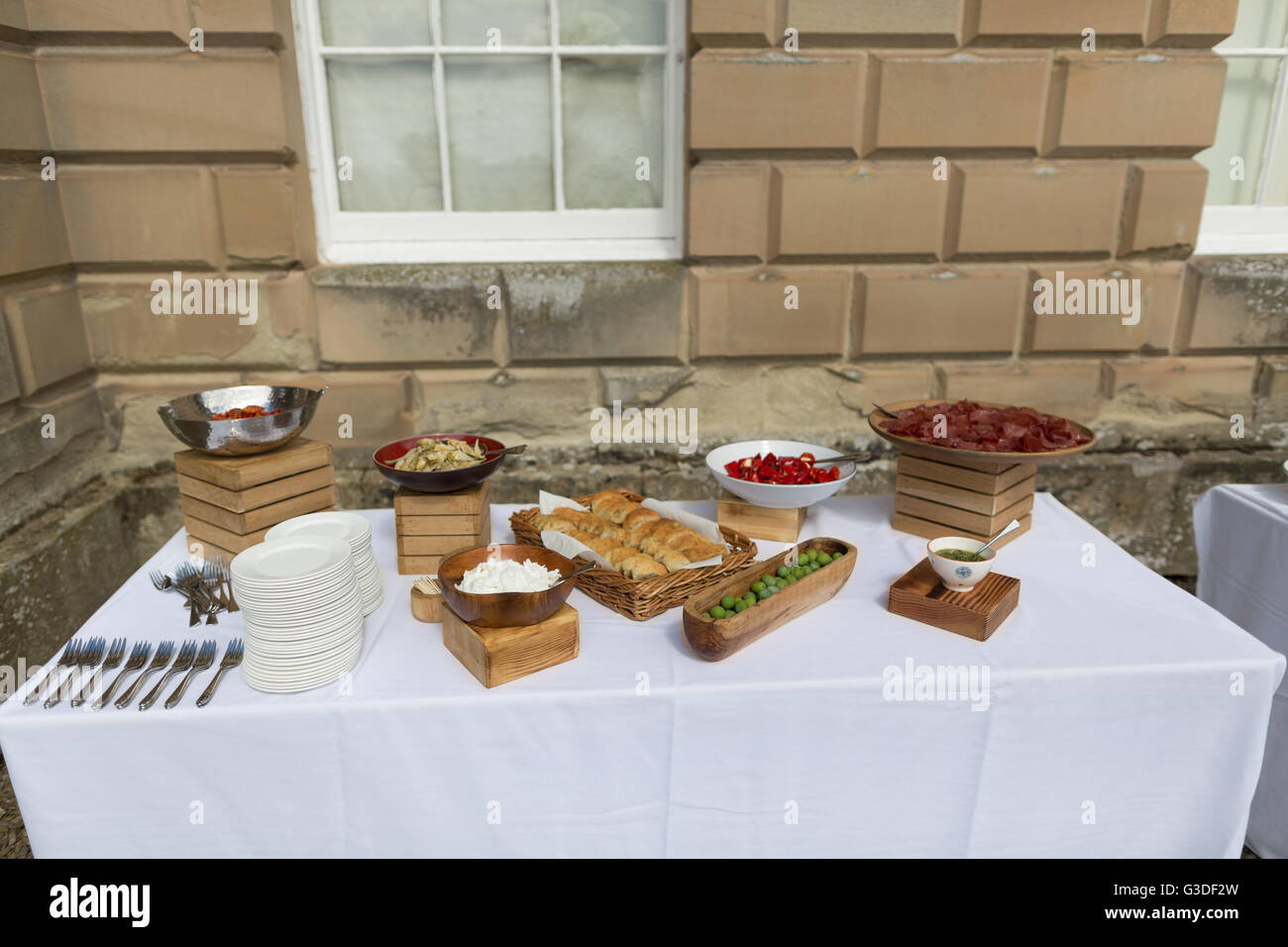 Buffet spread of food on a white table clothed table Stock Photo Alamy