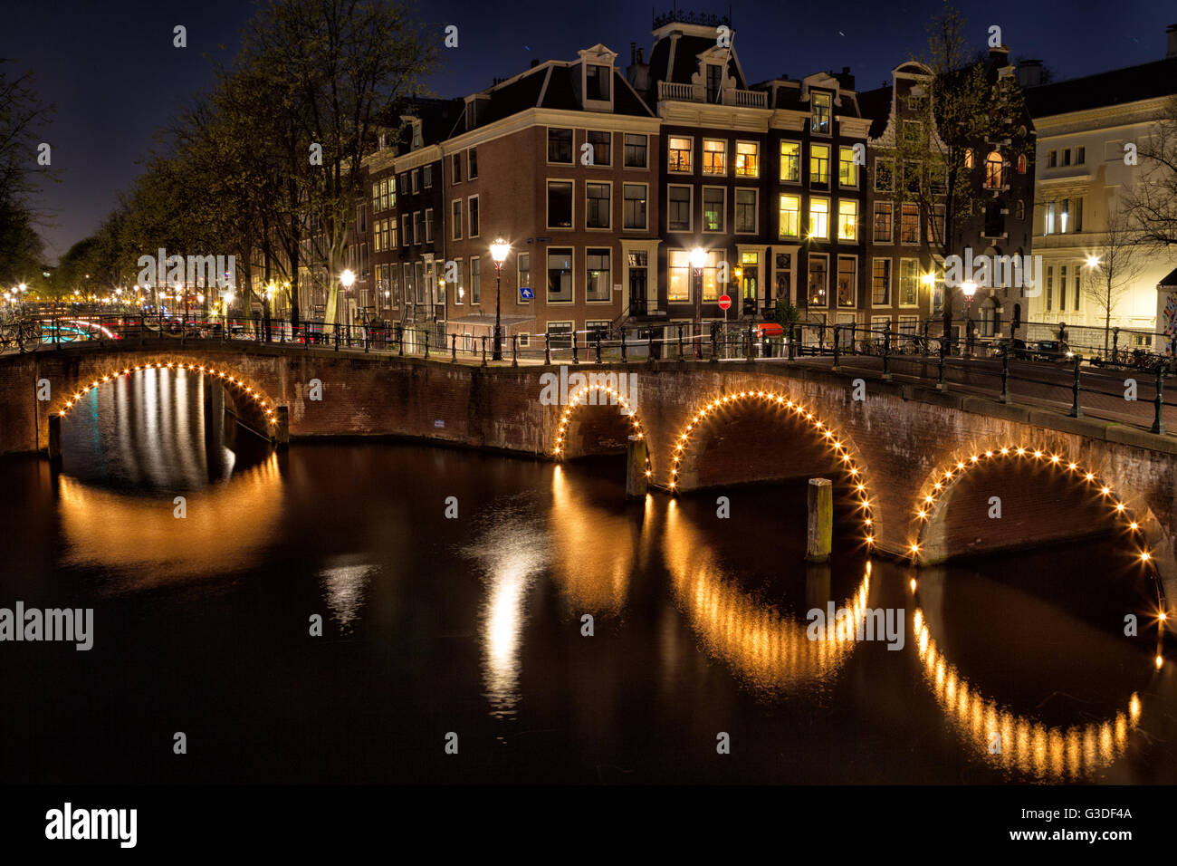 Night shot of the corner of Keizersgracht and Leidsegracht in Amsterdam, Netherlands. Stock Photo
