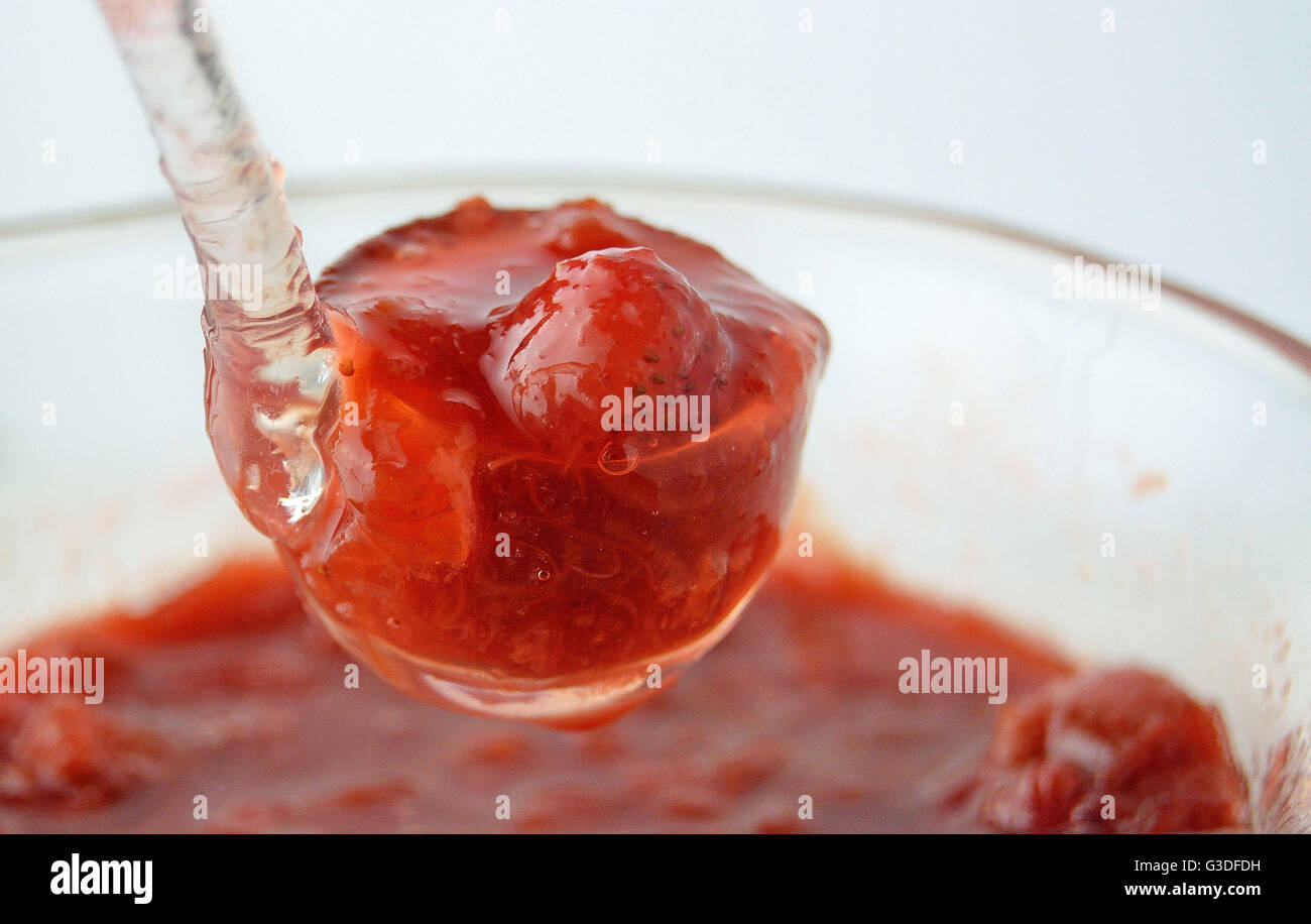 Rhubarb strawberry compote in glass ladle Stock Photo