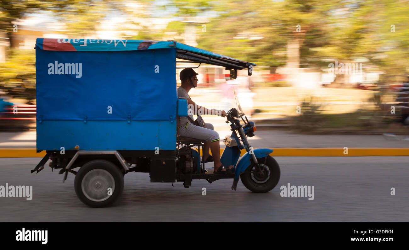 Delivered quickly with a Tuk tuk scooter in Cuba Stock Photo Alamy