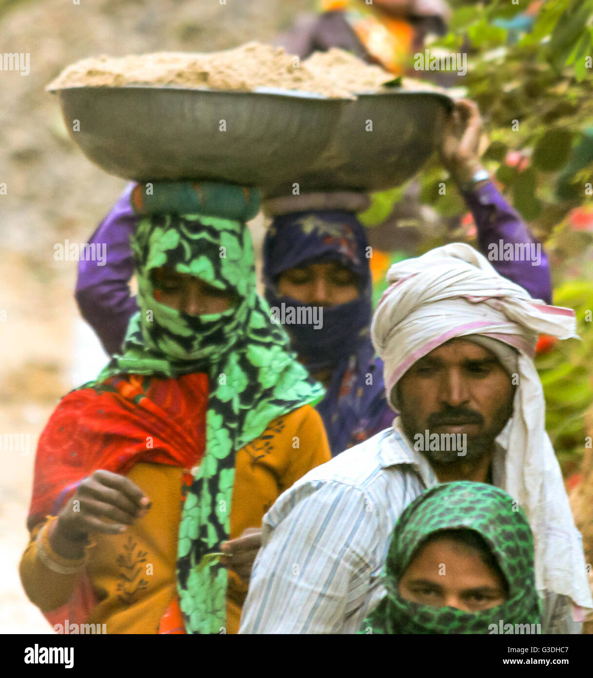 Low-caste  men and women digging road   India Stock Photo