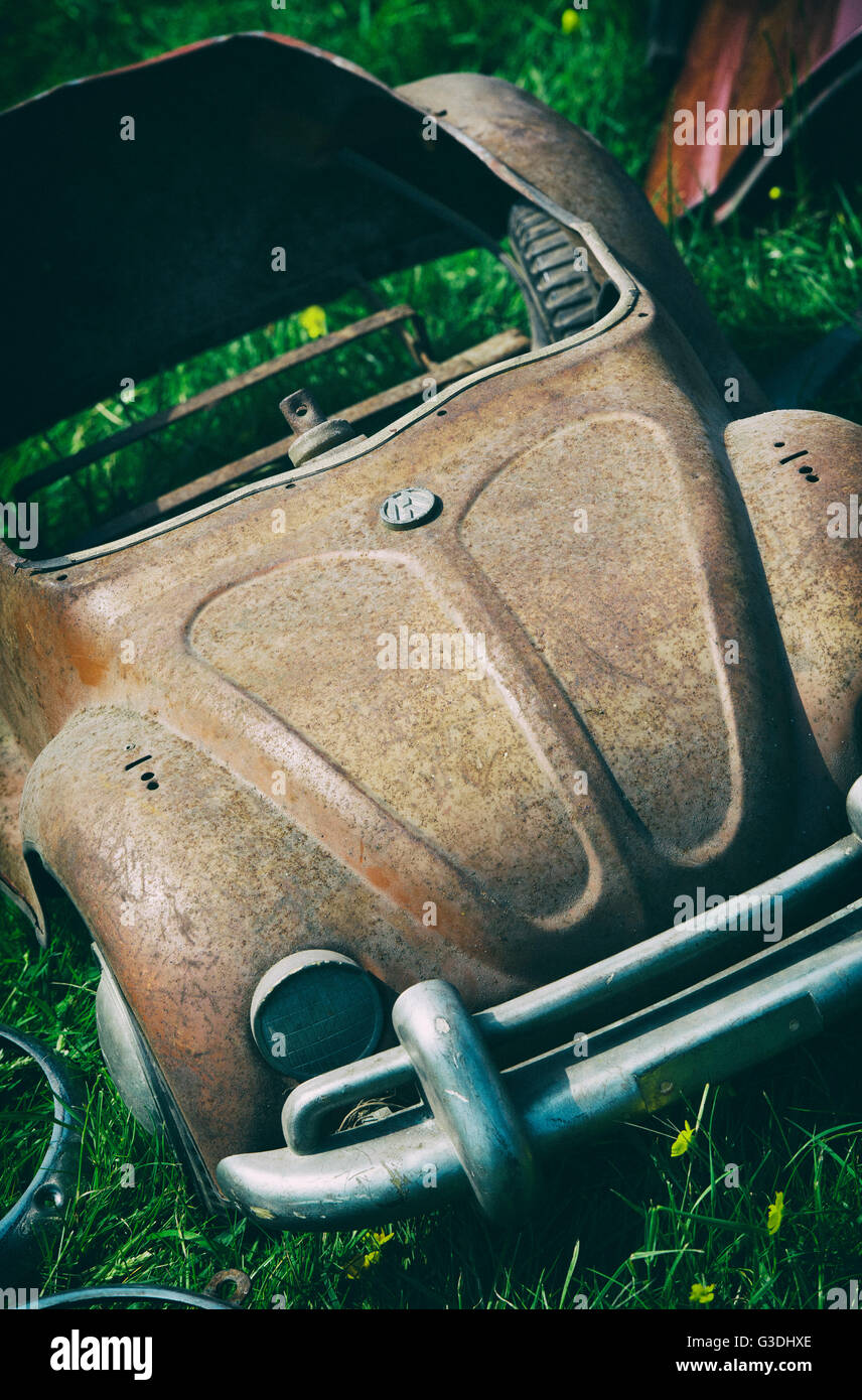 Old vintage rusty VW Beetle peddle car Stock Photo