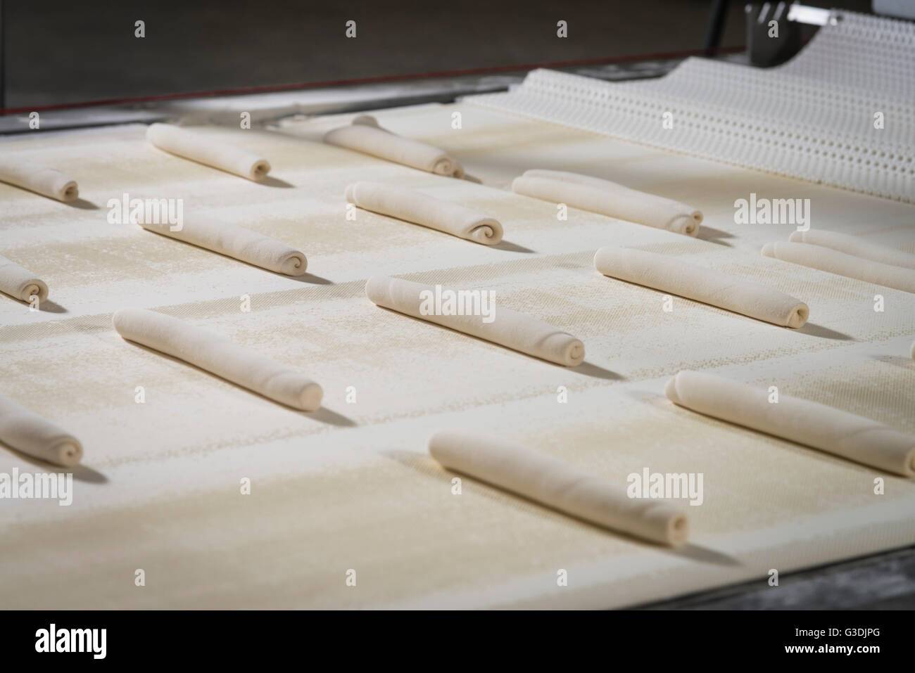 Raw Dough On Conveyor Belt, Bread Bakery, Philadelphia USA Stock Photo