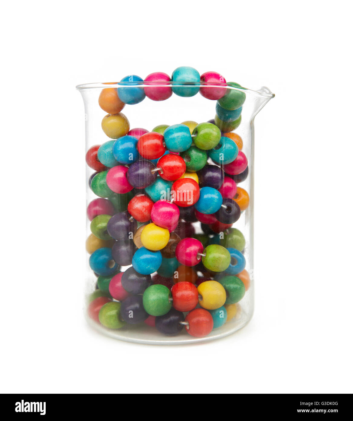 Little colorful wooden balls in a glass recipient isolated on white Stock Photo
