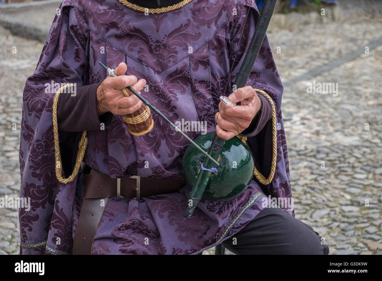Street musician with traditional instruments and clothing, Obidos, Estremadura, Portugal Stock Photo