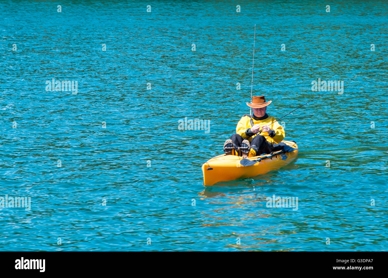 Kayak fisherman on the River Fal, Cornwall. Stock Photo