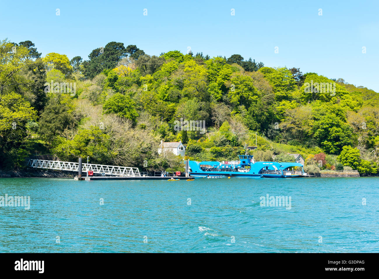 The King Harry Chain Ferry at the Feock Station on the River Fal, Cornwall.  To the left is the boat landing for Trelissick. Stock Photo
