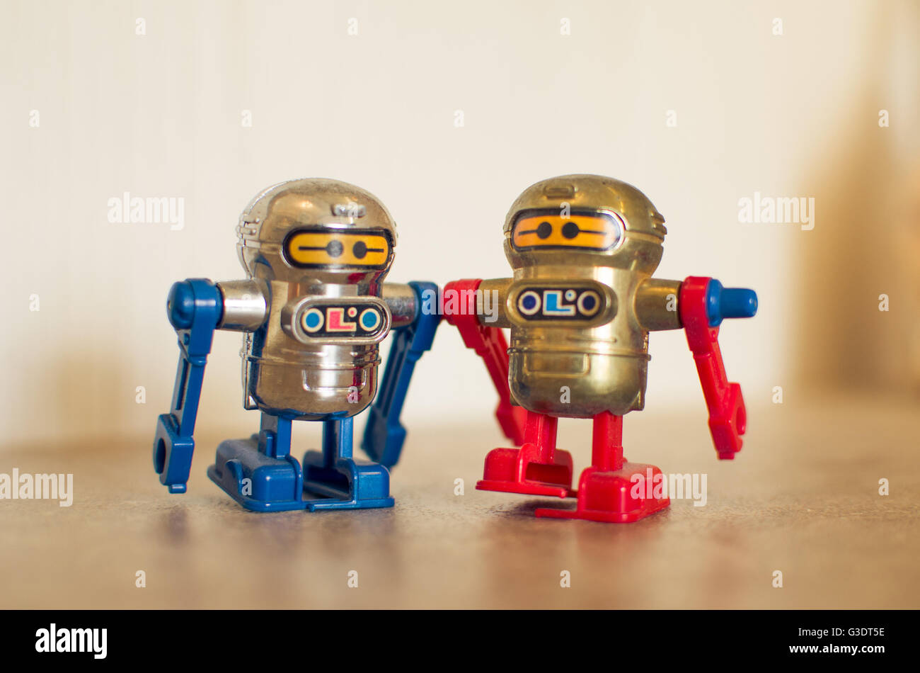 two small toy robots red and blue Stock Photo