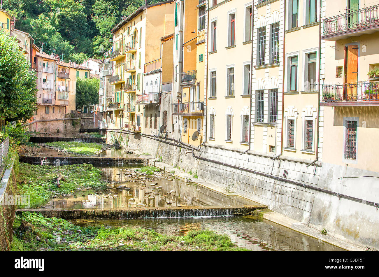 Reno river tributary canal  passing passes through village houses in Porretta Terme - Bologna Province - Emilia Romagna Stock Photo