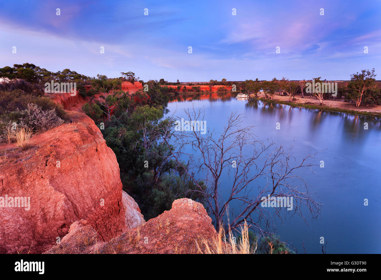Red cliffs of Murray river on the border between Victoria and New South Wales states of Australia. Elevated red bank of the rive Stock Photo