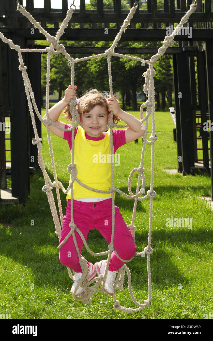 happy little girl on playground Stock Photo - Alamy