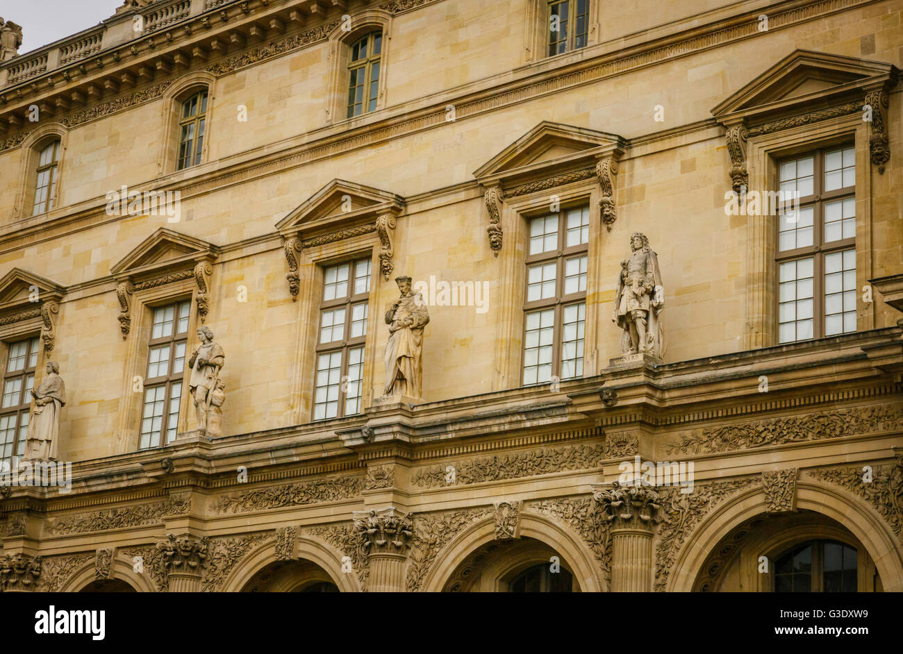 Row of statues over the facade of The Louvre Stock Photo Alamy