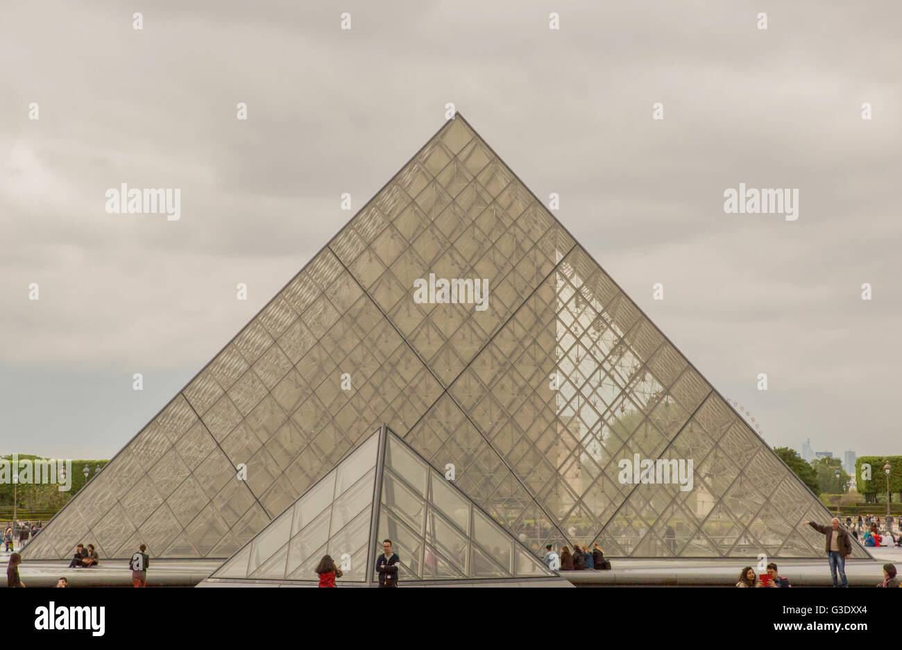 Tourists around the pyramids at the famous Louvre Museum Stock Photo