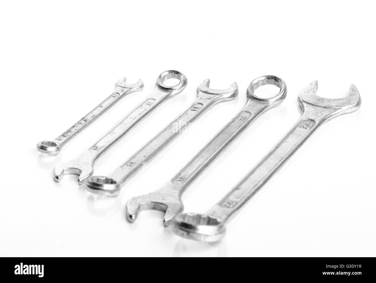 5 Wrench of different sizes aligned from smallest to biggest isolated