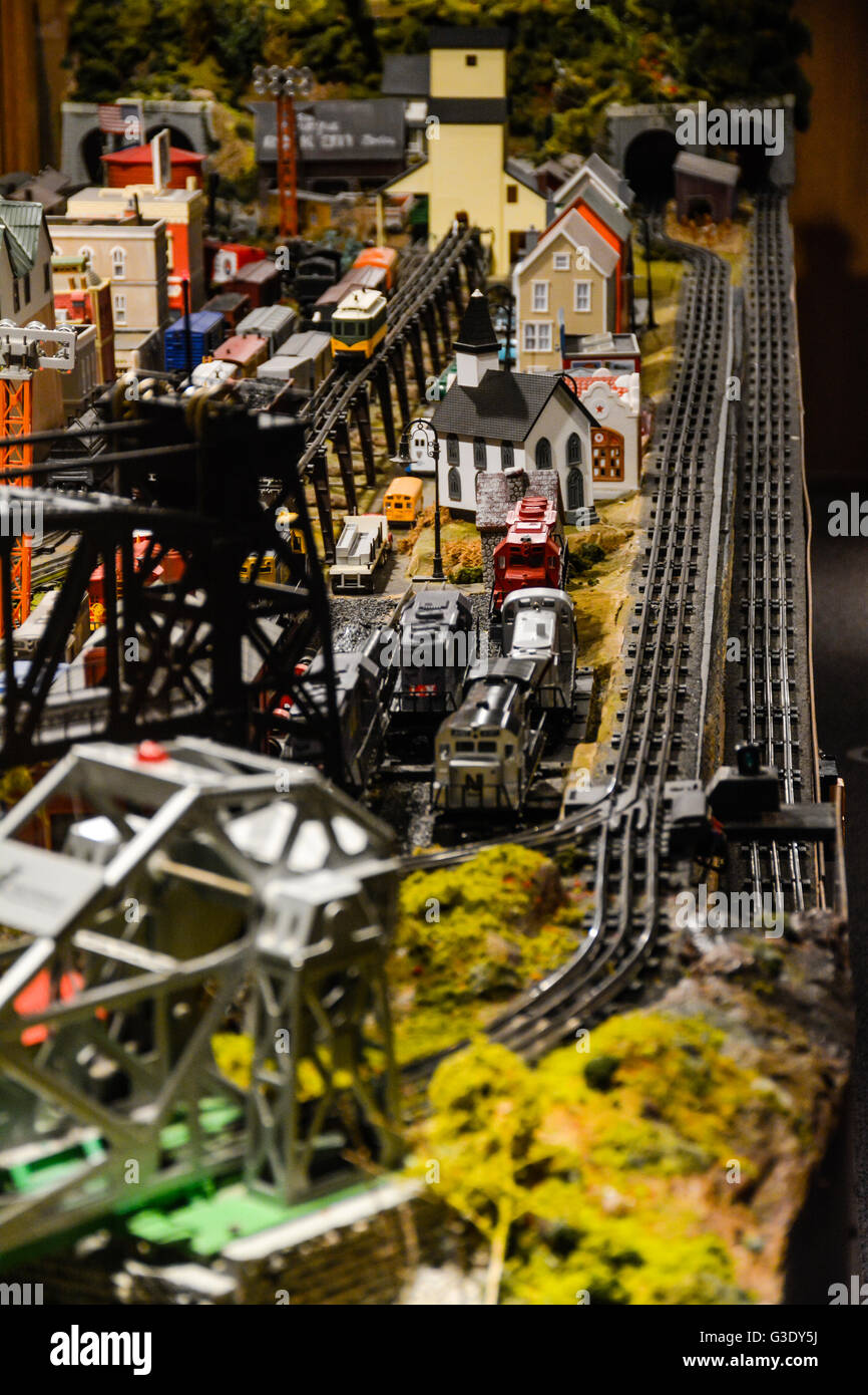 A vintage model train set reproduction of a town with tracks continues to delight hobbyist Stock Photo