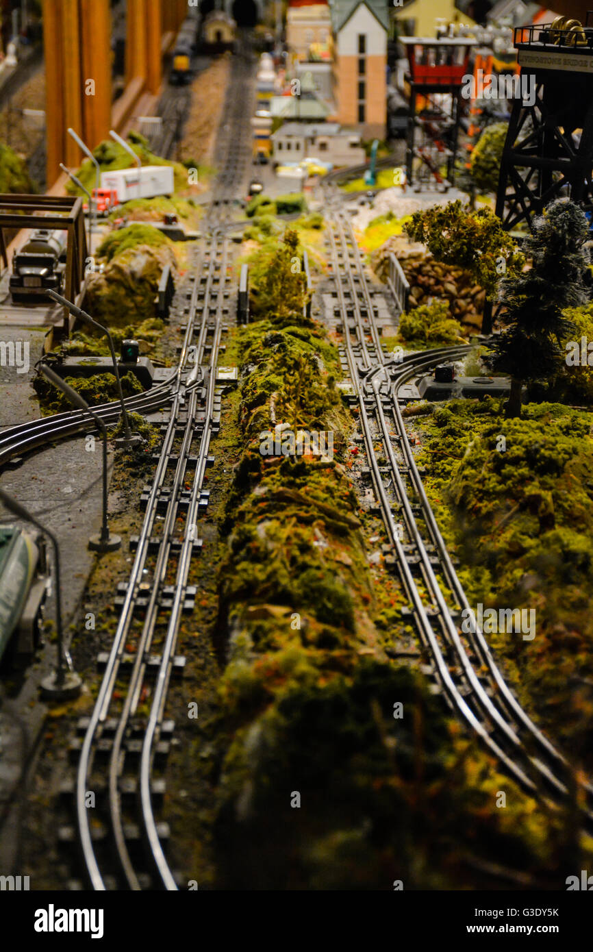 A vintage model train set reproduction of a town with tracks continues to delight hobbyist Stock Photo