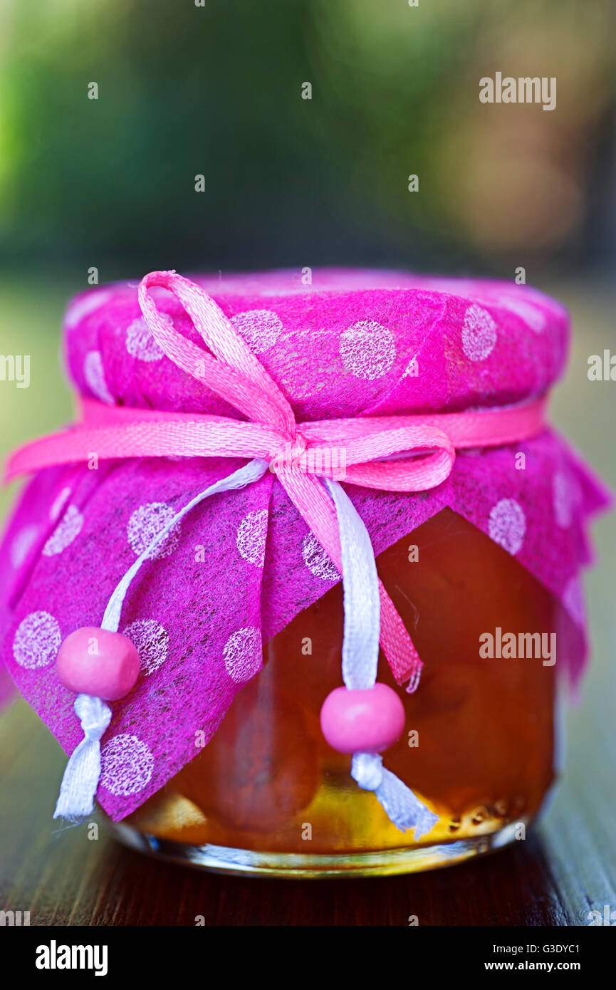 Decorative jar with preserved apricots Stock Photo