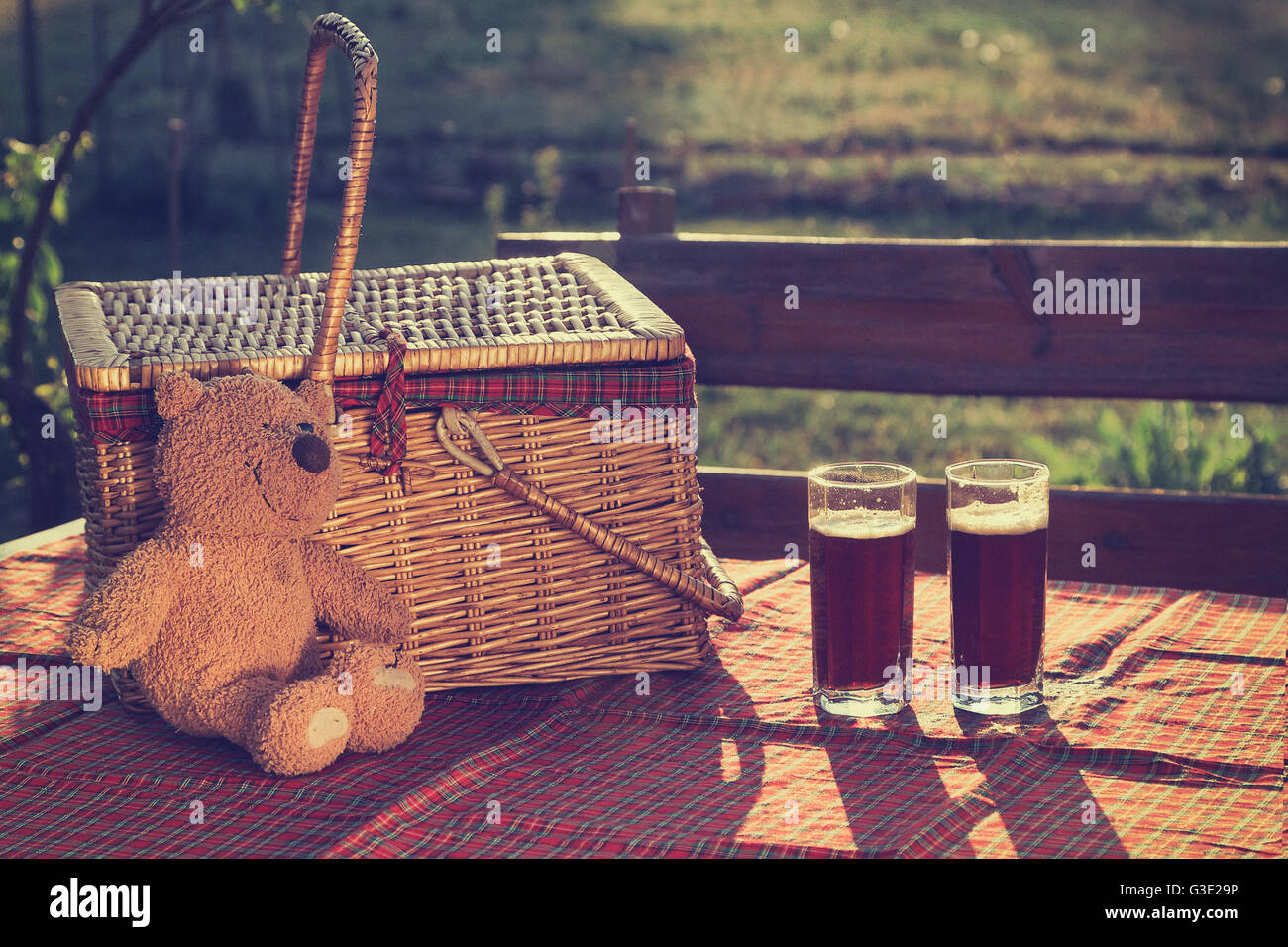 Picnic basket on the grass Stock Photo
