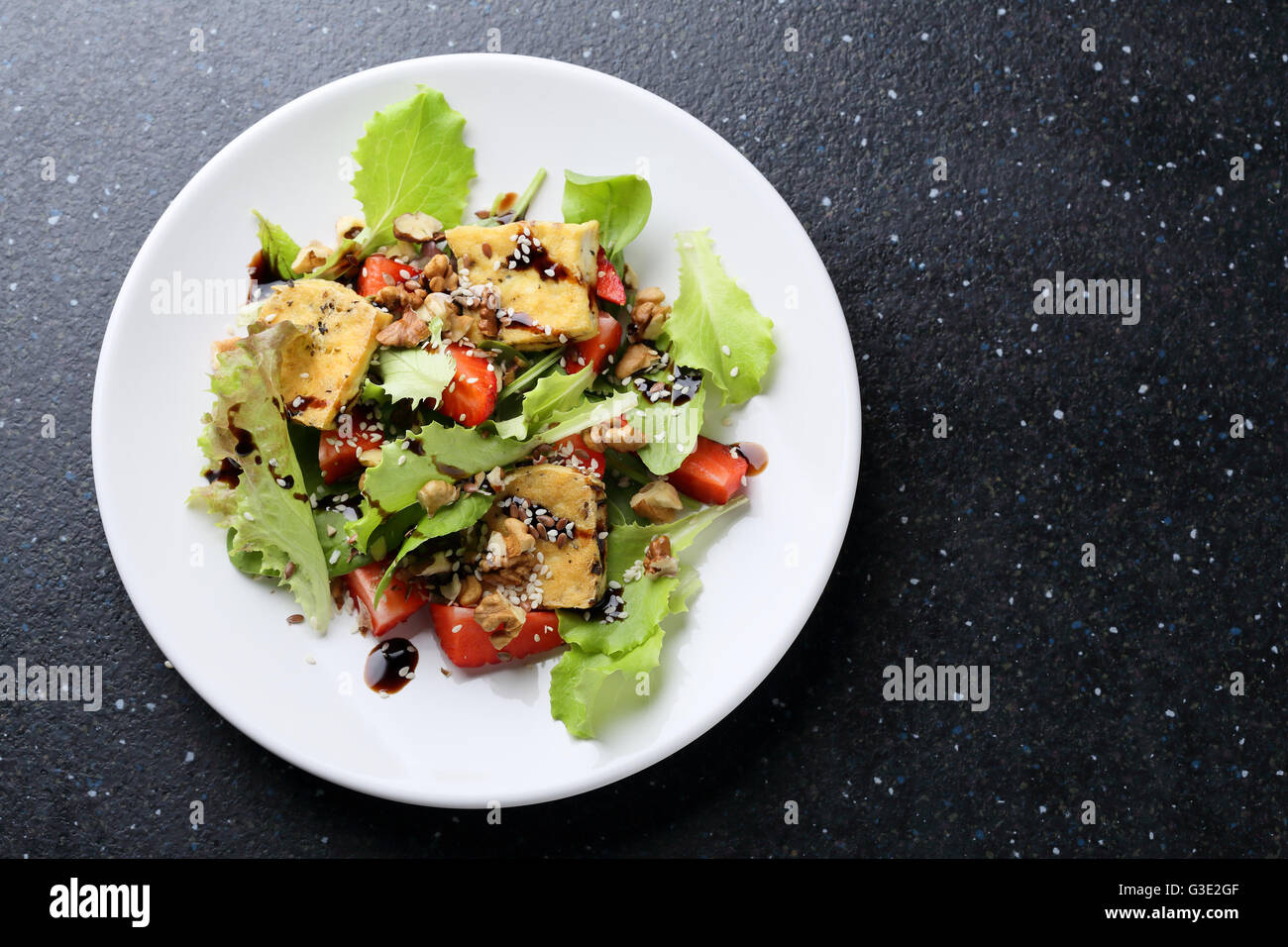 vegan salad with roasted tofu, food top view Stock Photo
