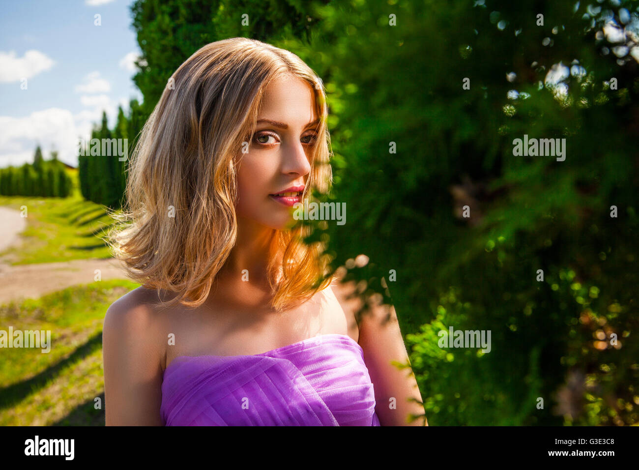 Blonde woman looking at camera hi-res stock photography and images - Alamy