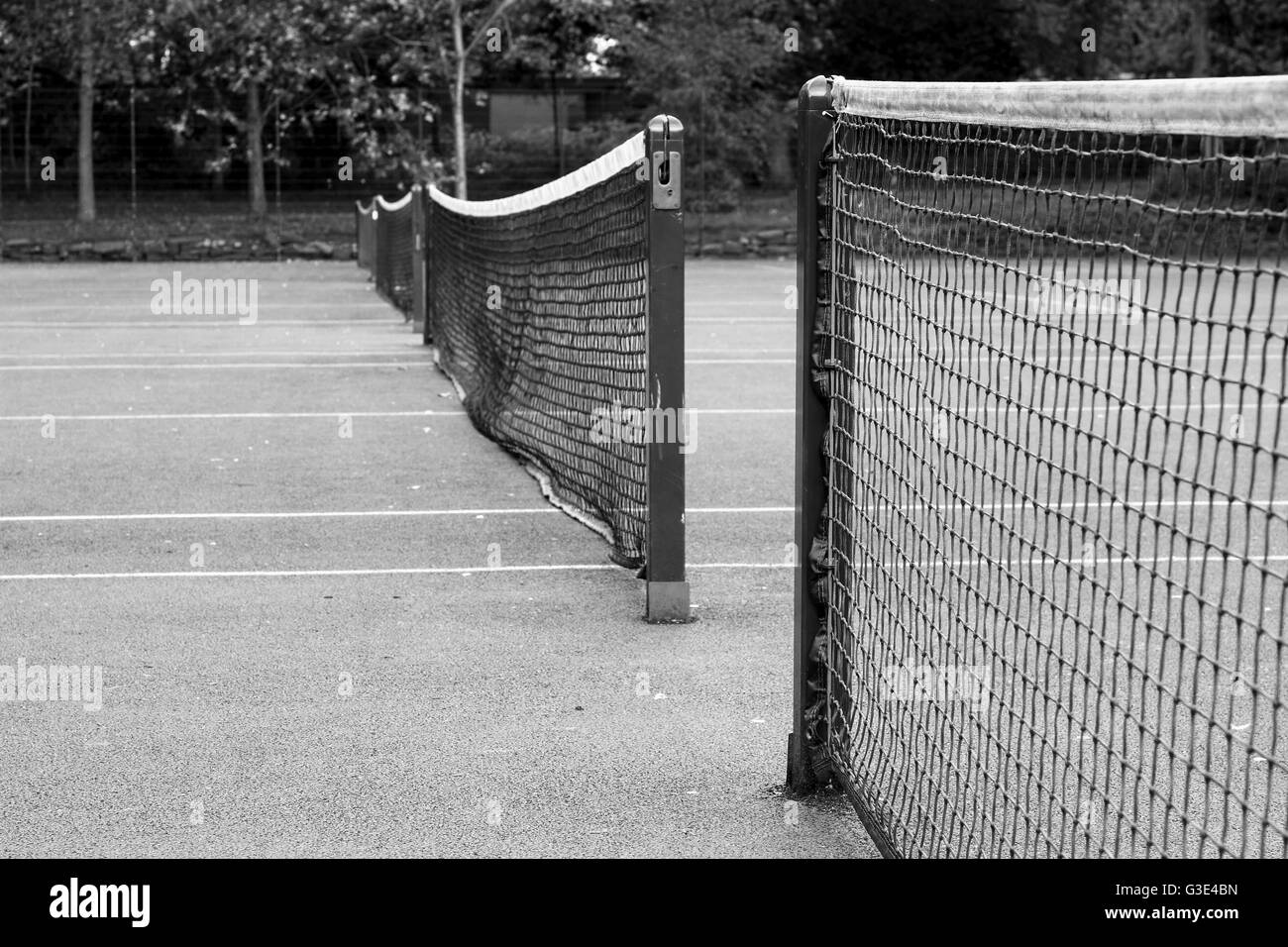 Black and white image of three tennis nets Stock Photo
