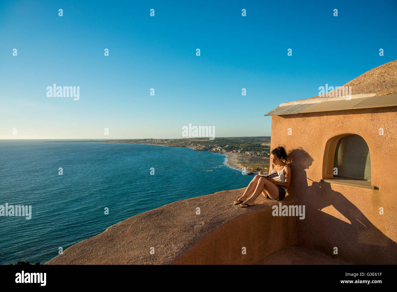 Girl painting from San Giovanni tower; Tharros, Sardinia, Italy Stock Photo