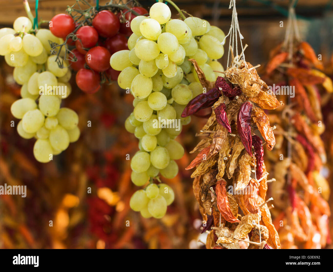 Fresh and dried fruit hanging; Positano, Campania, Italy Stock Photo