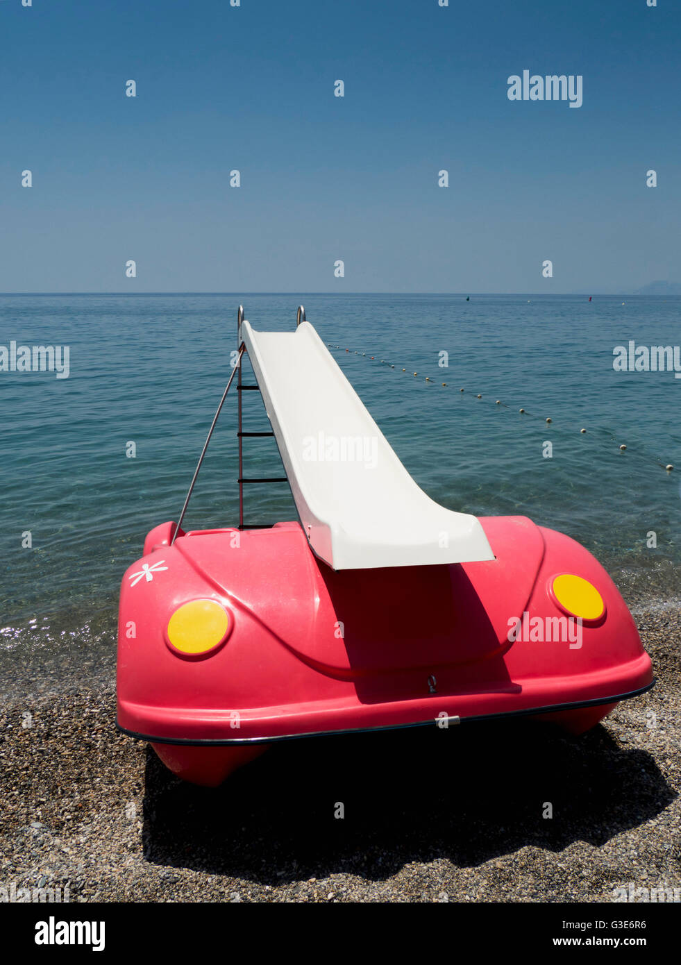 floating slide on the beach almunecar beach andalusia spain stock floating slide