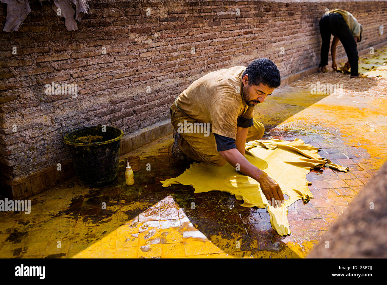 Fez, Morocco - April 11, 2016: One man working in a tannery in the city of Fez in Morocco. Stock Photo