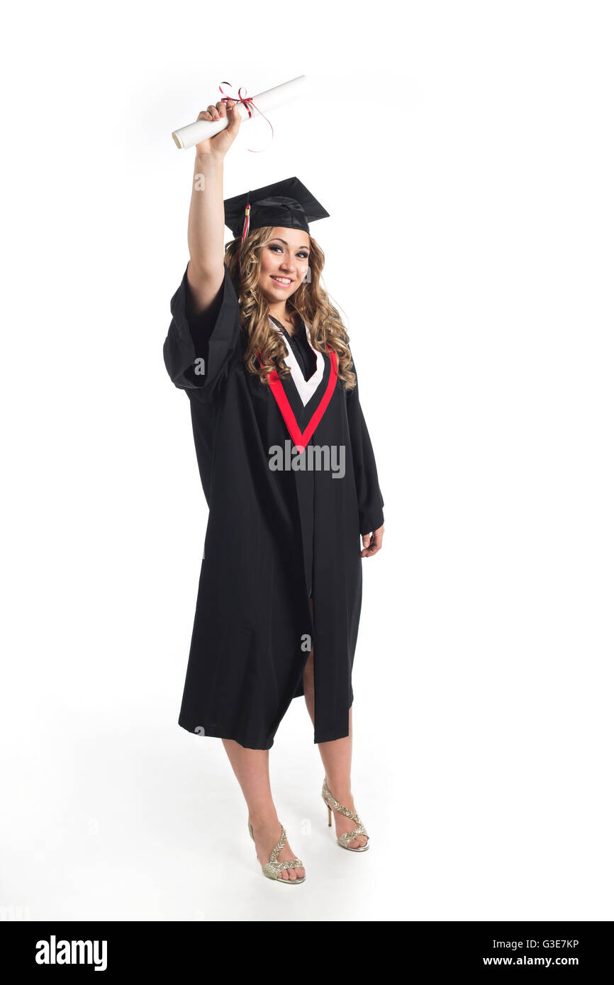 Young woman graduate holding her diploma up in celebration of her