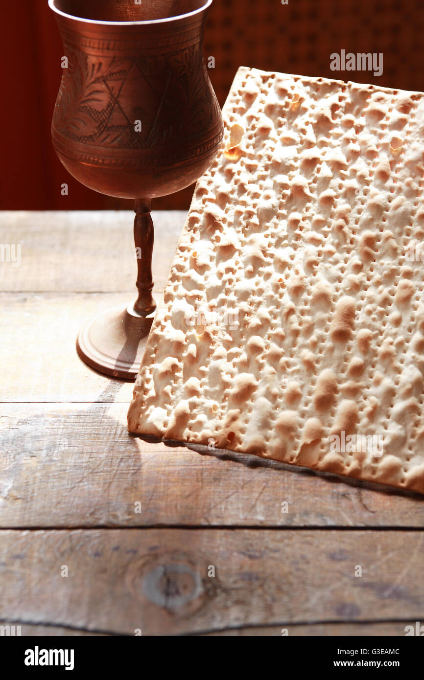 Seder concept. Still life with matzoh near metal wineglass Stock Photo
