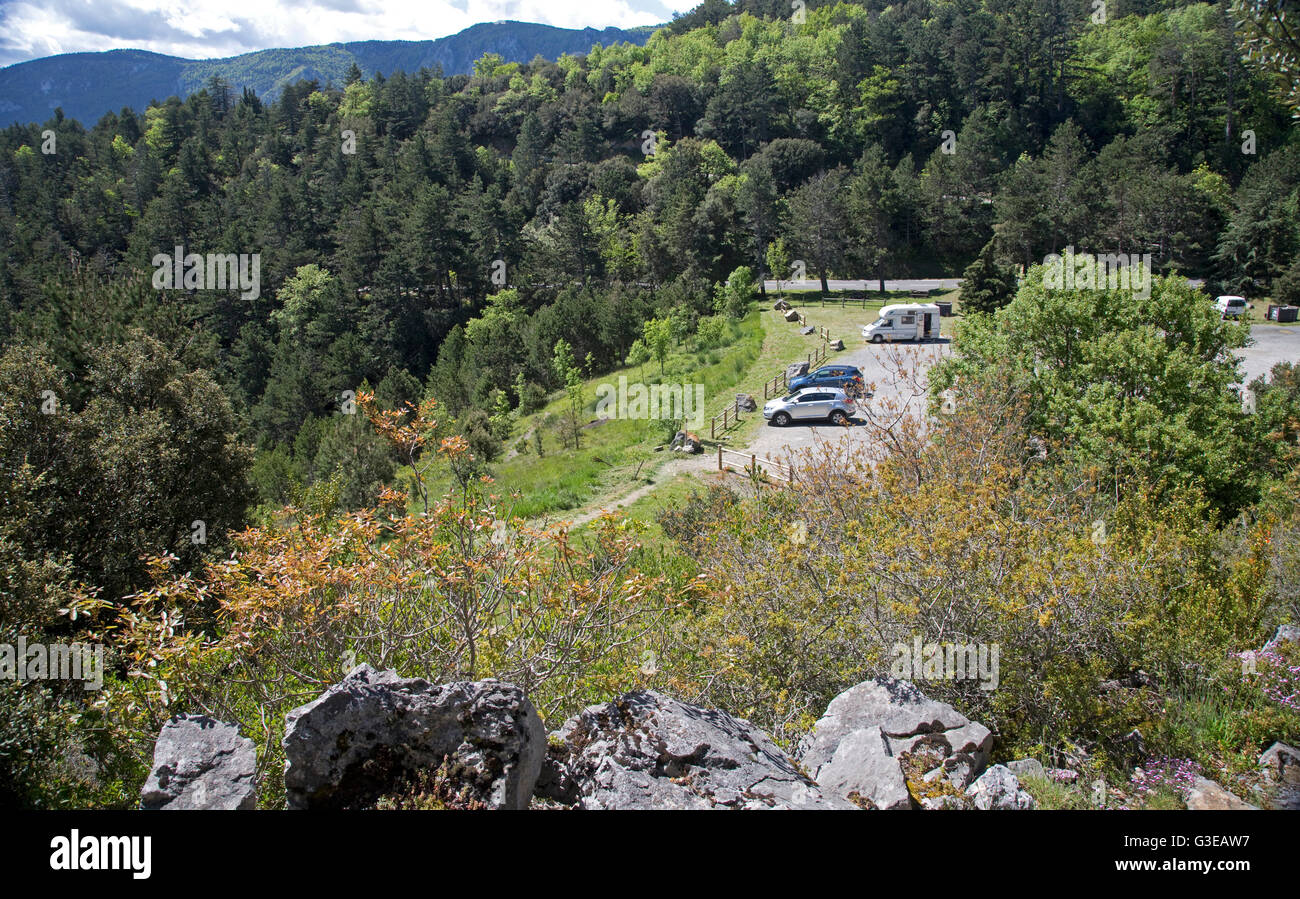 Cars parked in forested rest area near Ginoles Pyrenees France Stock Photo