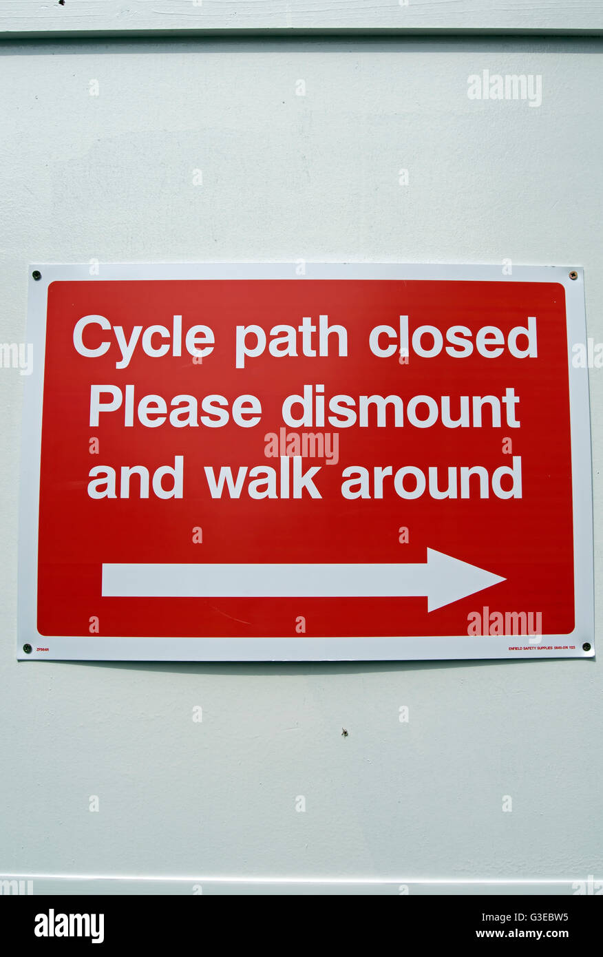 cycle path closed please dismount and walk around, sign in kingston upon thames, surrey, england Stock Photo