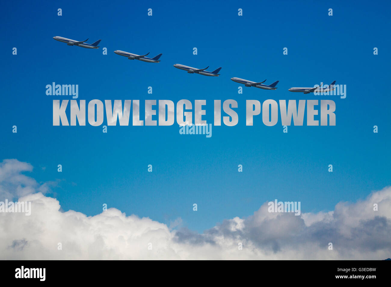 knowledge is power concept against blue clouds sky with five airplanes Stock Photo