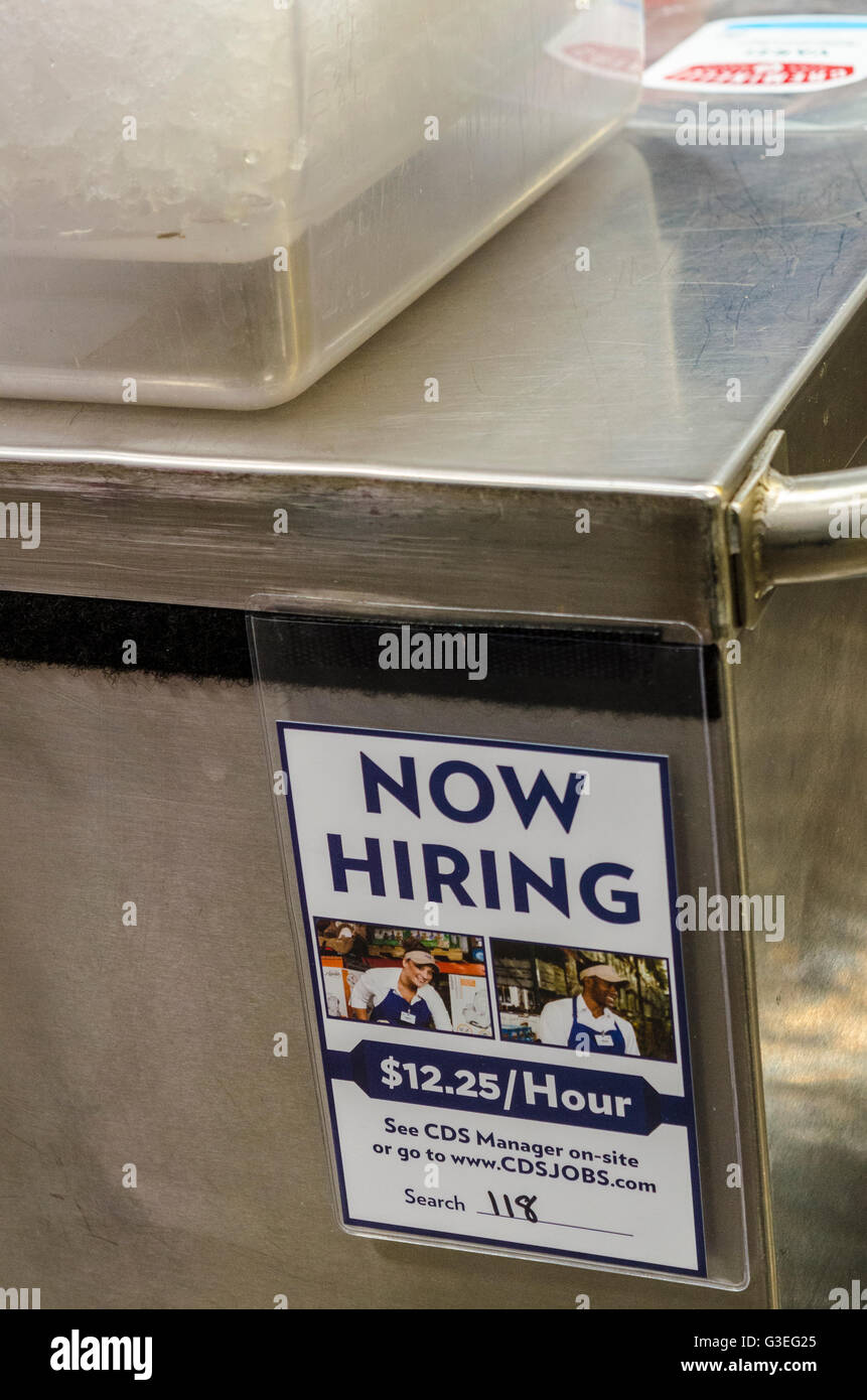 A now hiring sticker on a vendors cart at a Costco in San Leandro