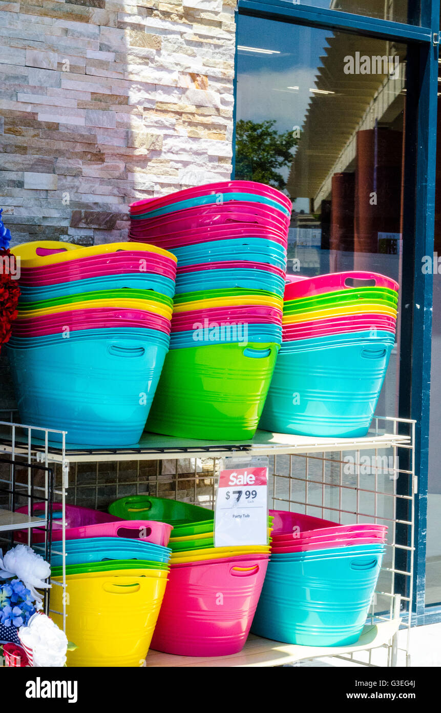 Stacks of colorful bowls on an outdoor display with a sale tag at a store in San Leandro California Stock Photo