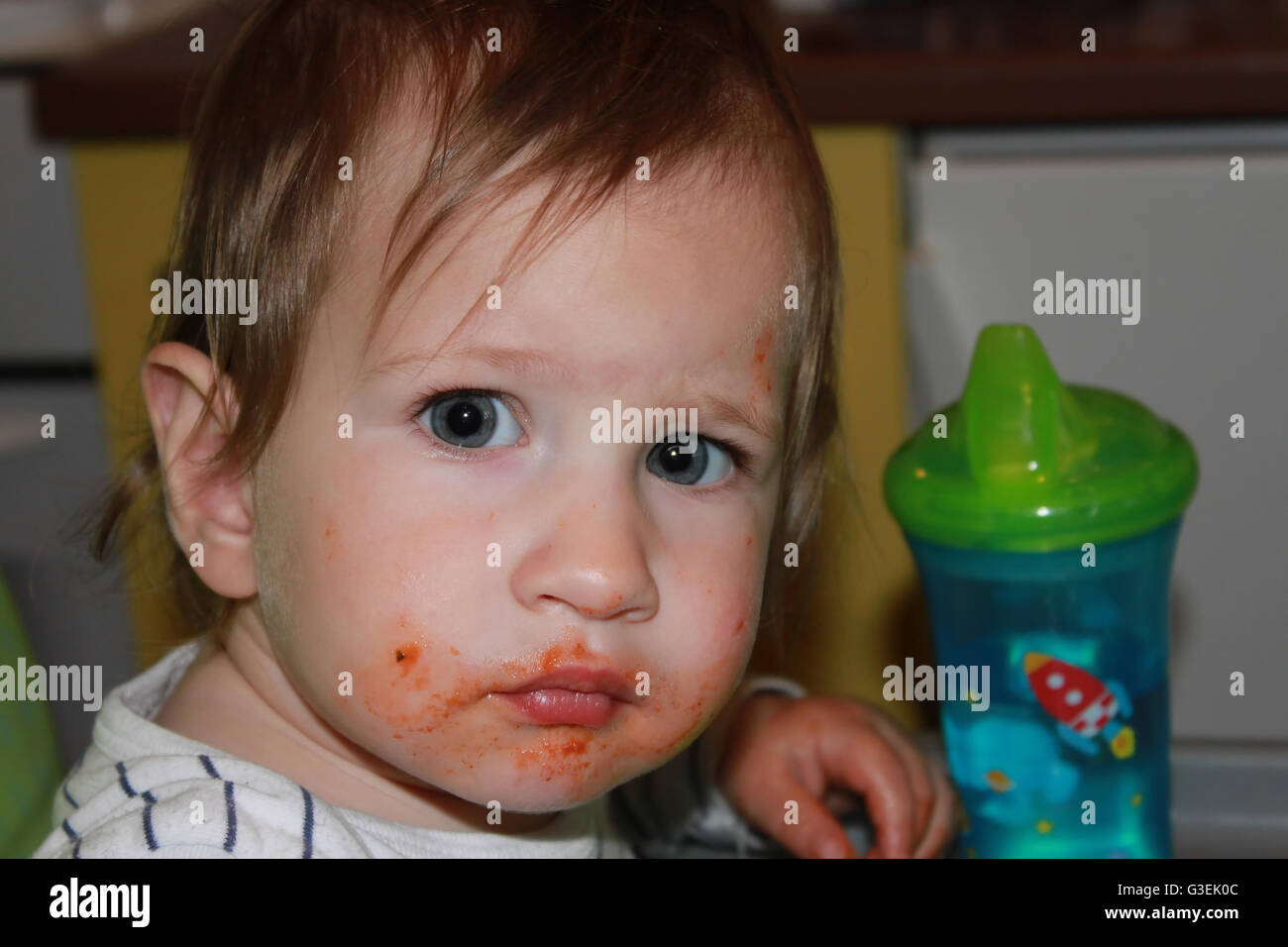 Baby making mess while eating Stock Photo Alamy
