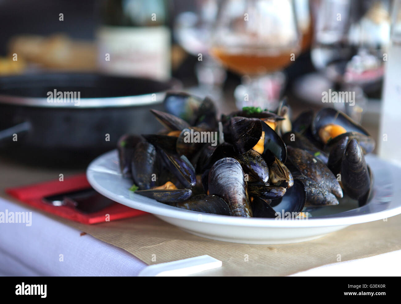 Dish with Cooked hot Mussels at Restaurant in Normandy Stock Photo