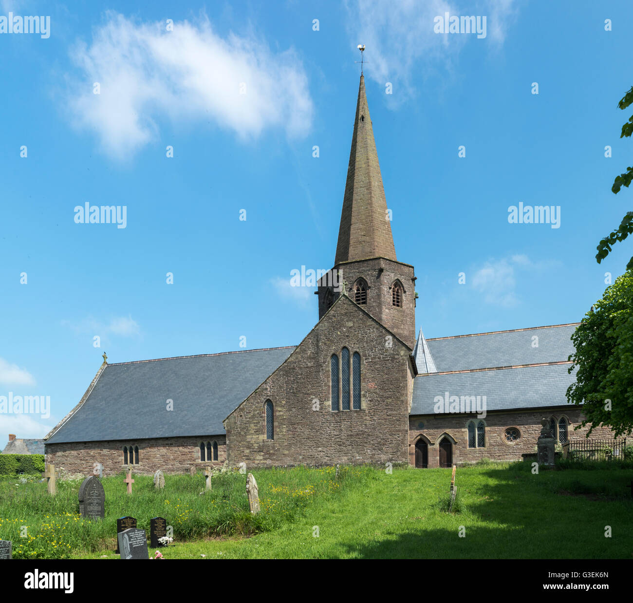 Large country church with spire on a summer day. Stock Photo