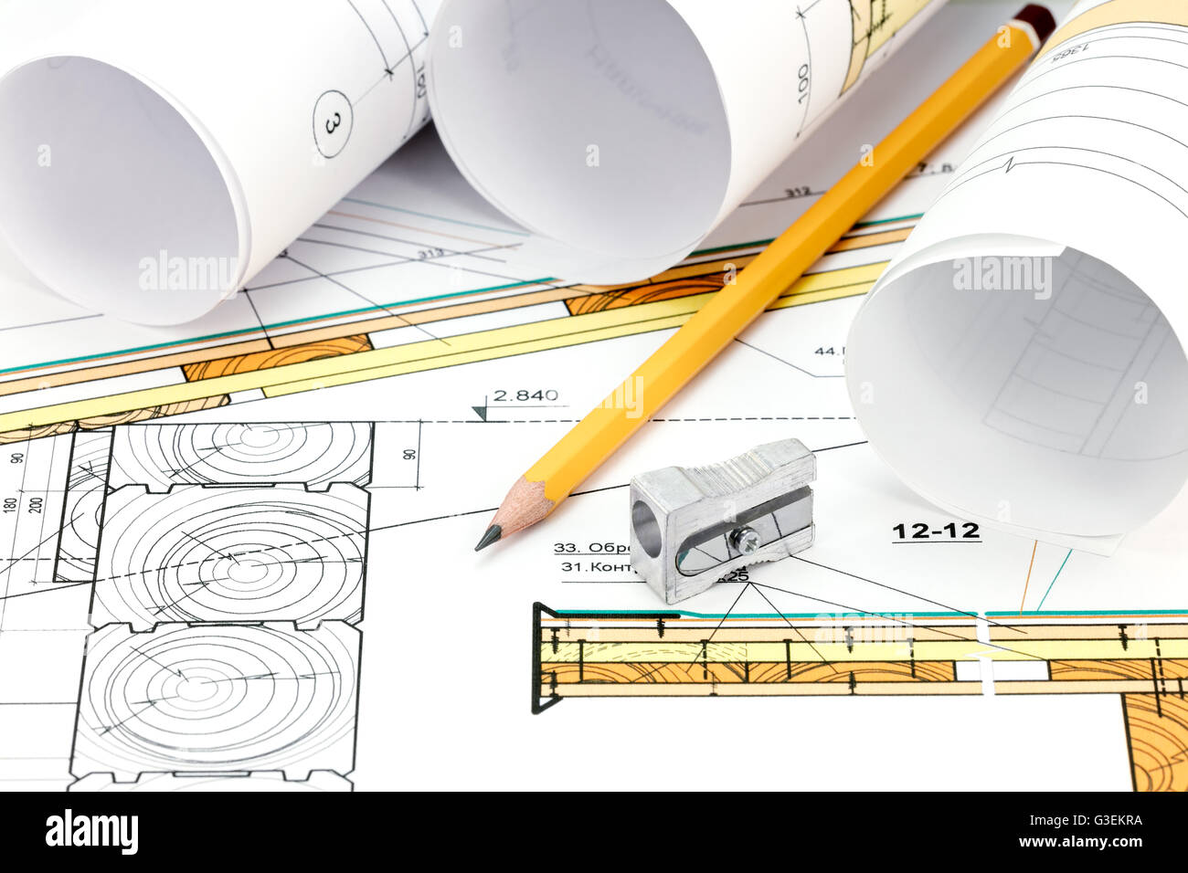 architectural background with blueprint rolls and technical drawing Stock Photo