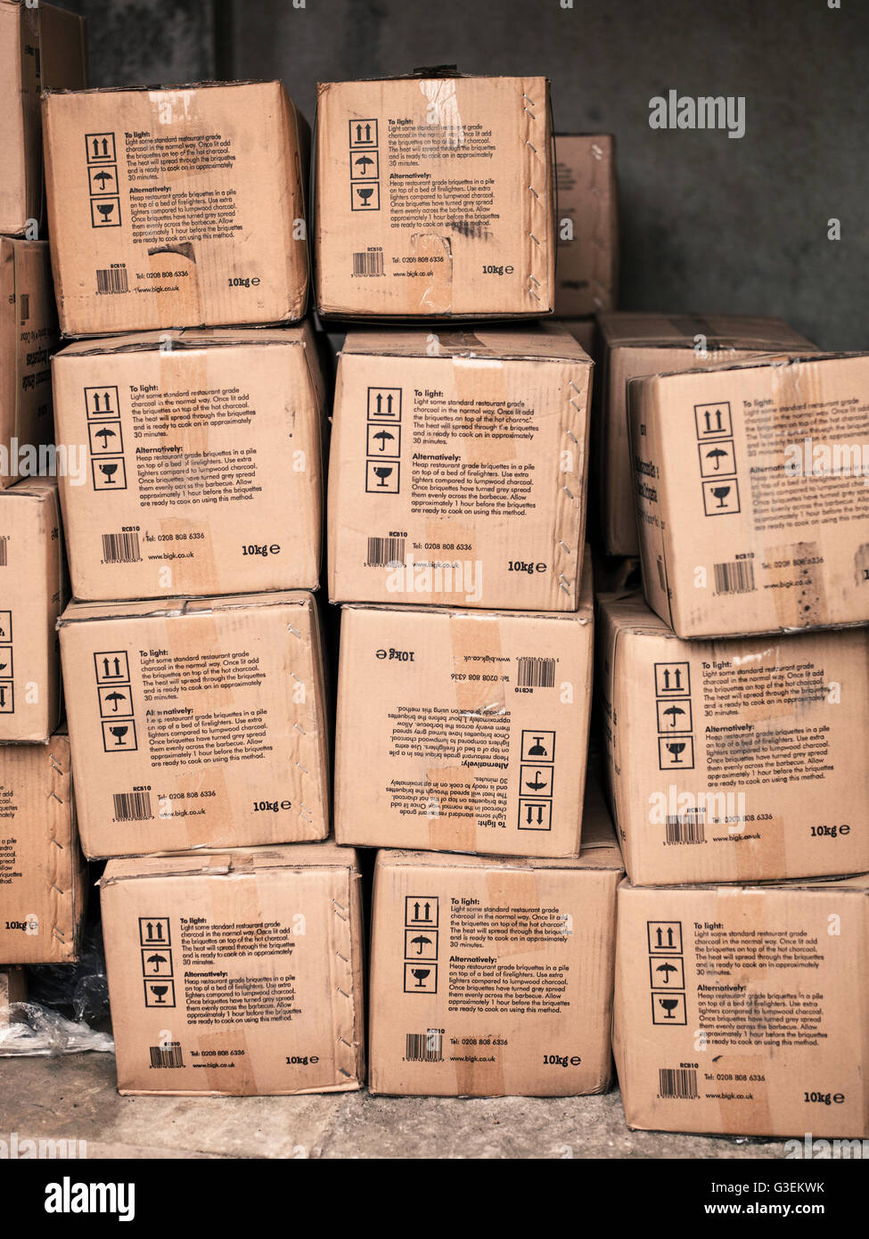 Pile or Stack of Cardboard Boxes Filled with BBQ Briquette Charcoal