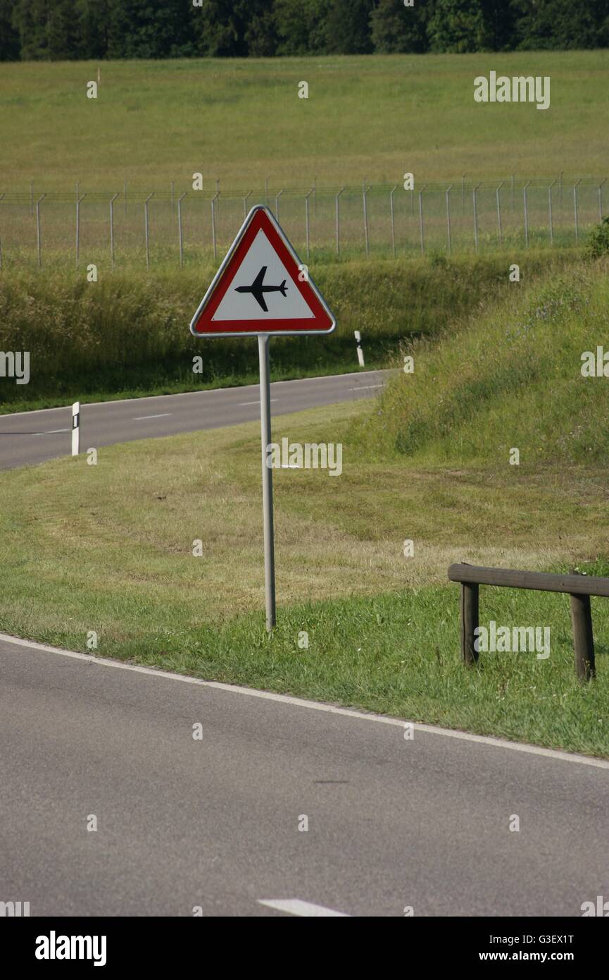 road sign, low flying aircraft Stock Photo