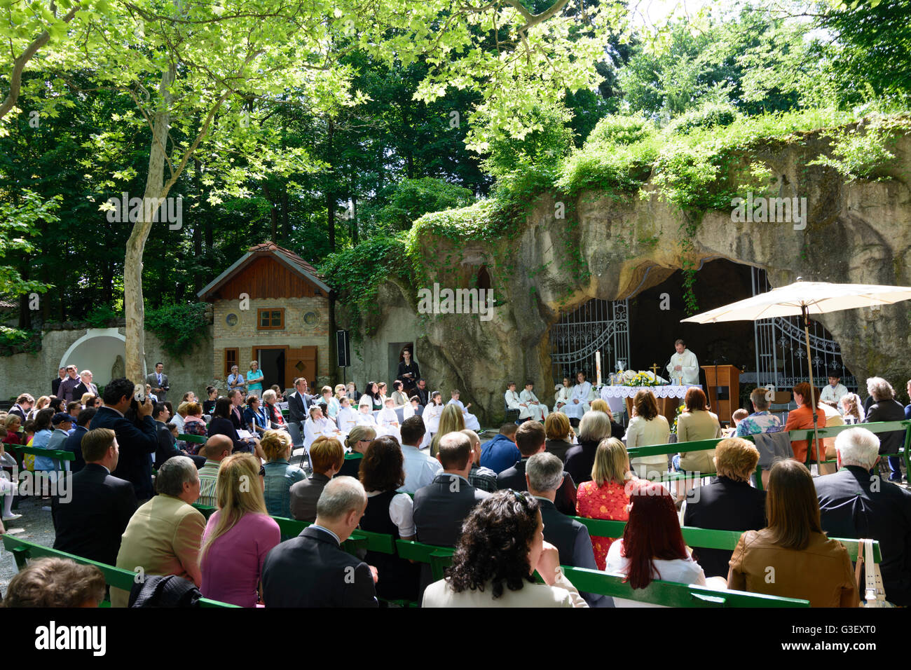 Lourdes Grotto in Maria Ellend at a first communion, Austria, Niederösterreich, Lower Austria, Donau, Haslau-Maria Ellend Stock Photo