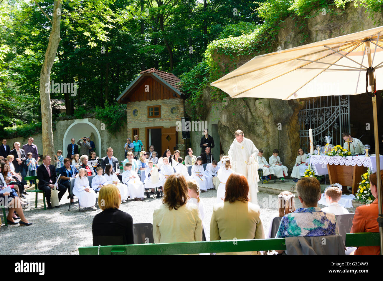 Lourdes Grotto in Maria Ellend at a first communion, Austria, Niederösterreich, Lower Austria, Donau, Haslau-Maria Ellend Stock Photo